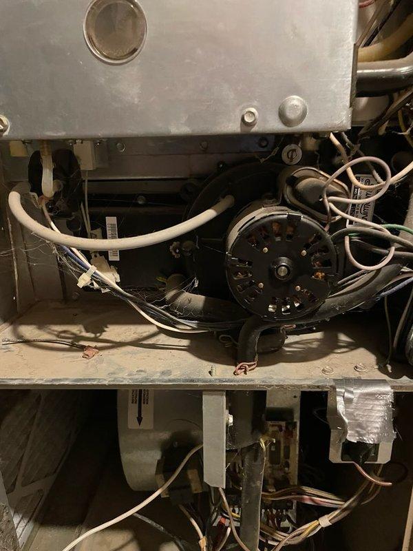 Diagnosed 22-year-old York furnace with no heat issue. Found inducer draft motor seized, running hot, and collector box cracked. Recommended replacement of both draft inducer motor and collector box due to age and condition of unit.