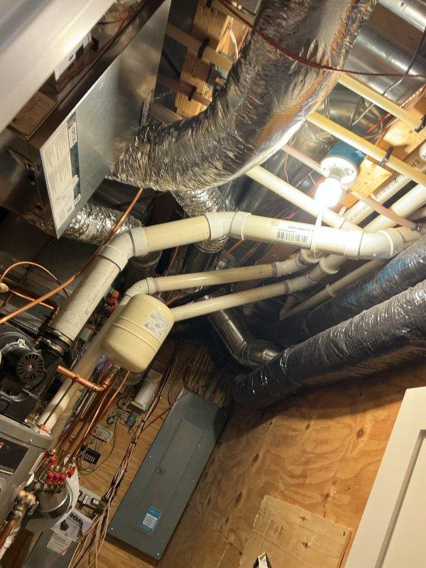 Performed scheduled water heater flush maintenance on 8-year-old unit as part of pre-paid service agreement. Inspected pressure gauge reading and verified proper system operation. Completed comprehensive plumbing inspection as part of family rewards program, examining mechanical room components including HVAC connections and water supply systems.