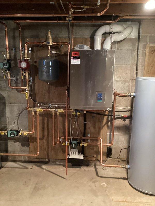 Performed annual maintenance on 8-year-old furnace and 14-year-old boiler under Family Rewards agreement. For furnace: cleaned flame sensor, verified proper condensate drainage, inspected heat exchanger and burners, checked filter and blower wheel. For boiler: cleaned igniter and flame sensor, confirmed proper system pressure and temperature settings. Both units tested operational with 50° temporize on furnace.