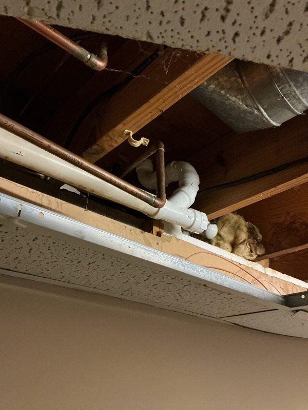 Identified and repaired a non-code-compliant PVC leak underneath the kitchen sink. Repiped both upper and lower portions of the kitchen sink drainage system, installing proper P-trap assembly and ensuring all connections meet current code requirements for improved compliance and functionality.