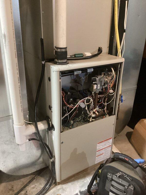 Responded to no-heat call for 20+ year old Gibson furnace. Diagnosed intermittent control board failure with pressure switch fault code. Upon inspection, discovered massive hole in heat exchanger, requiring immediate equipment shutdown and red-tag. Tagged out unit for safety concerns, documented damage with photos, and scheduled service advisor consultation to discuss replacement options versus heat exchanger and board repair.
