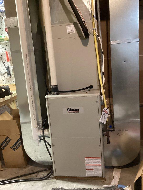 Responded to no-heat call for 20+ year old Gibson furnace. Diagnosed intermittent control board failure with pressure switch fault code. Upon inspection, discovered massive hole in heat exchanger, requiring immediate equipment shutdown and red-tag. Tagged out unit for safety concerns, documented damage with photos, and scheduled service advisor consultation to discuss replacement options versus heat exchanger and board repair.