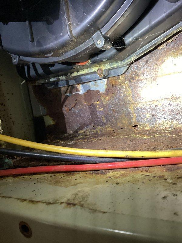 Responded to no heat call for aged Comfortmaker furnace (25-30 years old). Upon inspection, furnace initially presented with ignition failure, but system started correctly during testing and maintained proper flame. Observed significant rust deterioration around inducer motor housing with developing rust holes. Customer declined further diagnostics as unit is functioning at present but requested quote for complete system replacement due to age and condition.
