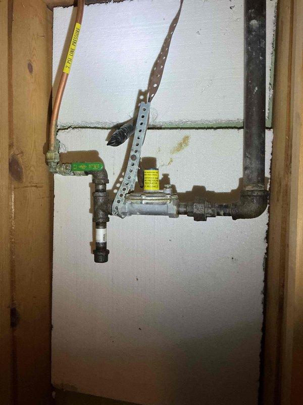 Responded to a gas leak service request. Located leak at black iron to copper adapter fitting, which was previously identified by the gas company. Verified leak with bubble test, completed repair, and pressure tested both the repaired fitting and adjacent copper flare fitting to confirm integrity. Service included restoring gas supply and relighting water heater pilot.