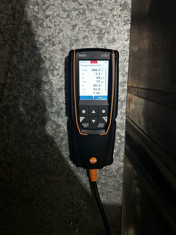 Performed complete preventative maintenance on 20-year-old Goodman furnace at end of expected service life. System operating safely with proper gas pressure, good electrical connections, and clean filter. Maintenance included cleaning flame sensor, verifying ignitor operation, and checking amp draws on inducer and blower motors. Condensation drains clear; noted some rusting but heat exchanger appears intact. Observed significant water discharge from adjacent water heater.