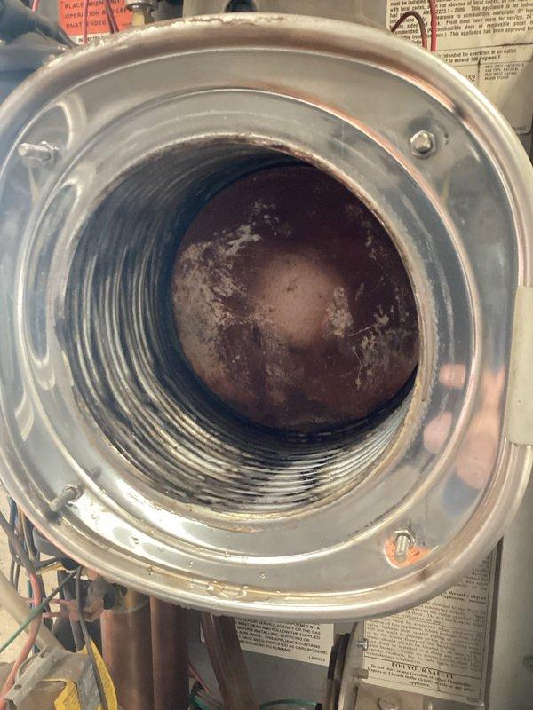 Performed comprehensive tune-up service on both gas boiler and heat pump systems. Cleaned heat exchanger, flame sensor, and spark rod on the Lennox gas boiler located in garage, removing visible scale buildup. Inspected all heat pump components and verified proper system operation. Both systems functioning correctly upon completion of maintenance.