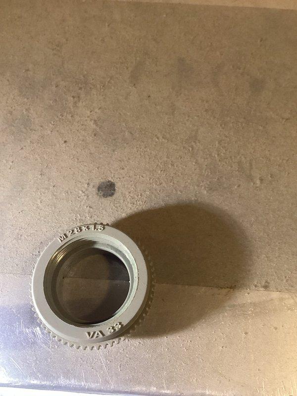 Diagnosed overheating issue in upper bedrooms of residence with geothermal system. Inspection revealed two defective zone power heads that were causing constant heat calls and temperature control problems. Removed and replaced malfunctioning actuators to restore proper zoning functionality and temperature regulation.