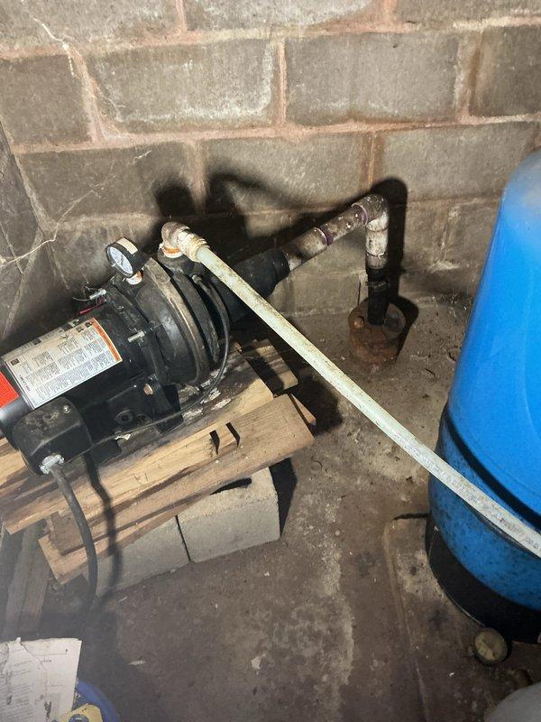 Resolved fluctuating water pressure issue by replacing faulty pressure tank. System inspection revealed pressure switch was operating properly but tank had failed. Additionally, capped off unused PVC waterlines and an abandoned cast iron pipe from previous toilet installation per customer's request.