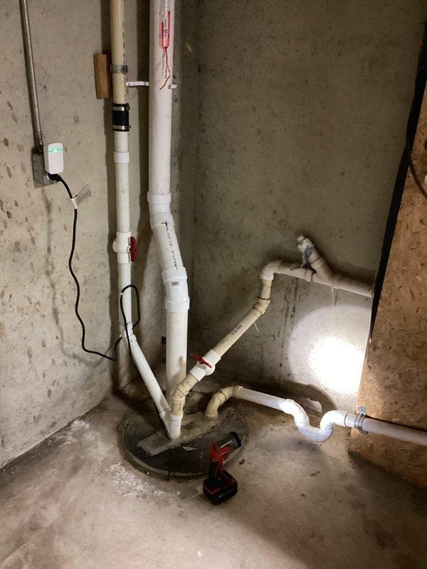 Performed inspection of customer's sump pump system that was previously flagged by another contractor as incorrectly installed. Identified leaking discharge hose and assessed overall installation. Provided customer with estimate for battery backup sump system as a recommended upgrade for additional protection during power outages.