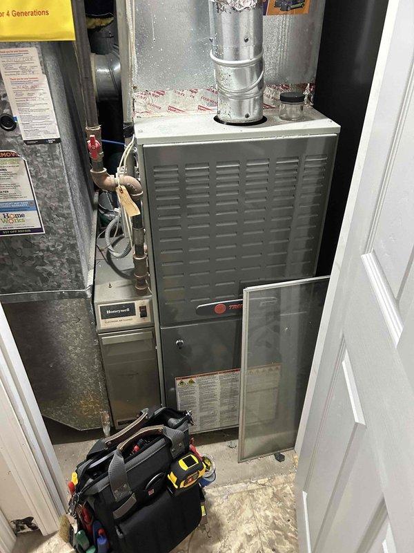 Performed comprehensive furnace tune-up on unit 4+ years old, including heat exchanger inspection, flame sensor rod cleaning, carbon monoxide safety verification, gas pressure adjustment, and burner examination. All systems functioning properly with no issues detected. Discussed maintenance plan options with homeowner.