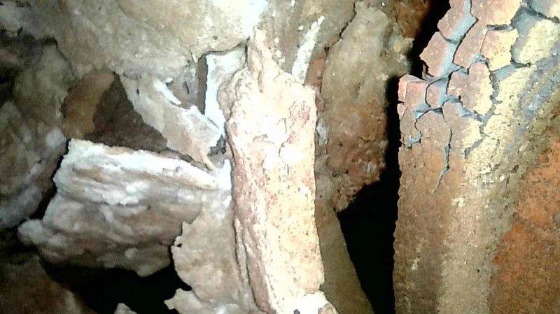 Responded to no-heat call for 1977-era furnace that failed to restart after initial operation. Diagnosed primary limit switch trip and reset to restore temporary functionality. Visual inspection with camera revealed severely deteriorated refractory pot sitting crooked inside furnace, with significant cracking and fragmentation especially on the right side. Due to extensive deterioration and age of system (45+ years), repairs not feasible. Customer currently using alternative wood heating source and understood replacement recommendation.