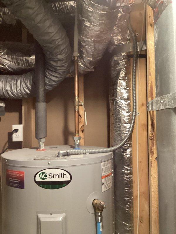 Diagnosed 80-gallon electric water heater leaking from the bottom due to tank rupture. Informed customer the unit requires complete replacement and advised that residential units in this size have been phased out. Recommended heat pump water heater as an alternative with available tax credit ending this year. Customer will contact us with decision after consulting with spouse.