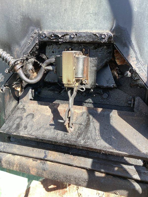 Inspected 25-year-old central wood boiler experiencing airflow issues when door is closed. Identified significant buildup in flue and cleanout areas as confirmed by visual inspection. Checked front door damper, actuator, and inside damper; recommended deep cleaning, chimney stack replacement, and scheduled follow-up consultation to discuss repair options or potential replacement given the unit's age.