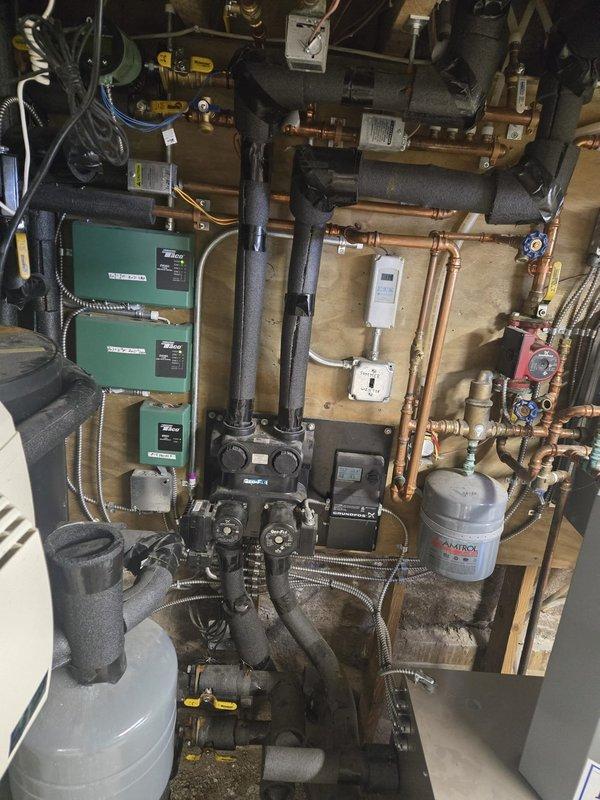 Responded to call regarding no hot water. Diagnosed and replaced failed zone valve for boiler system. Found system water level critically low, refilled to proper operating level. Cycled system to confirm proper operation, verified hot water restoration, and noted quieter system operation after service.