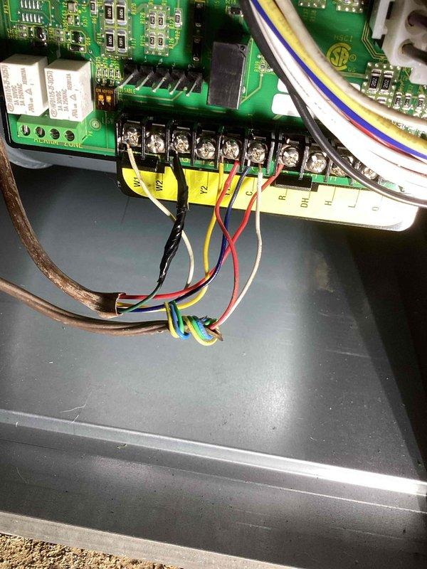 Responded to warranty call for newly installed furnace system operating without thermostat control. Diagnosed incorrect low-voltage wiring connection where installers had connected condenser wiring to the control board instead of proper thermostat wiring. Corrected all terminations at the control board and verified system operation with proper temperature control restored.