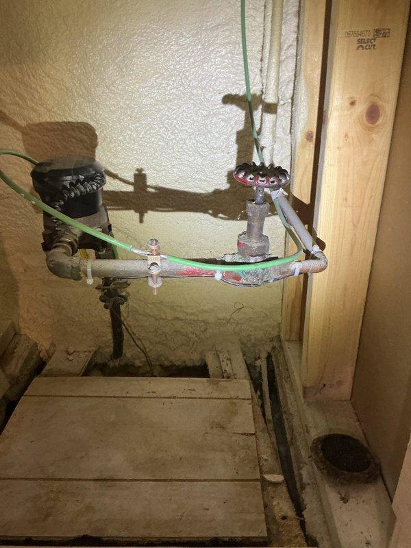 Conducted diagnostic assessment on 17-year-old water heater producing only lukewarm water. Visual inspection revealed significant age deterioration and probable heating element failure. Provided customer with replacement options including necessary minor repipe work.