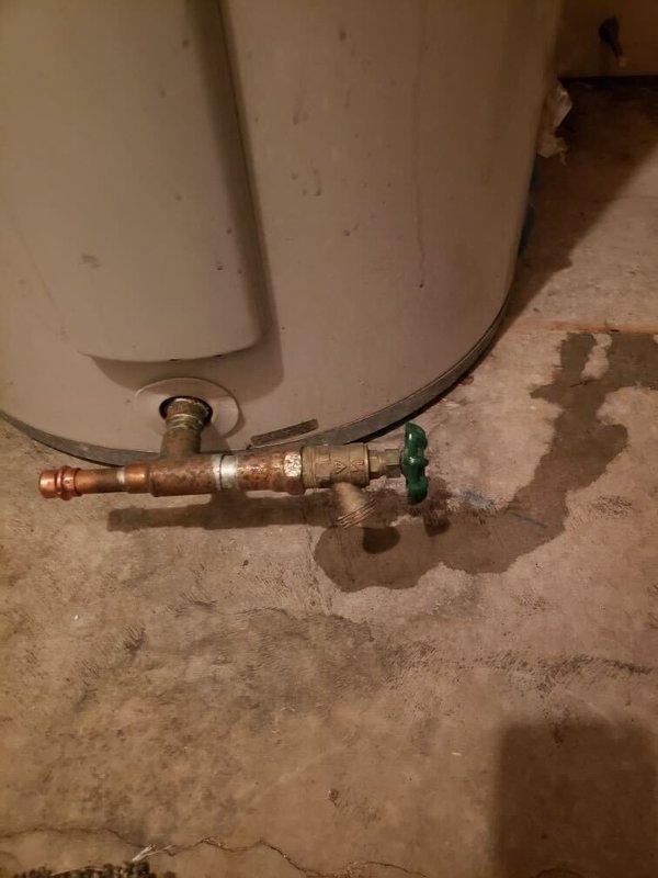 Responded to service call regarding water heater valve leak. Identified slow drip from boiler drain at bottom of water heater (approximately one drip every 20 seconds). Tightened existing drain handle and installed protective cap to prevent further leakage. Responded to service call regarding water heater valve leak. Identified slow drip from boiler drain at bottom of water heater (approximately one drip every 20 seconds). Tightened existing drain handle and installed protective cap to prevent further leakage.