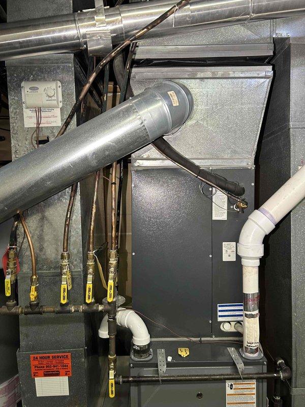 Performed annual tune-up service on 3-year-old Amana HVAC system. Conducted furnace maintenance including cleaning flame sensor, adjusting gas pressure, and clearing condensation trap. Carbon monoxide reading measured at 13 ppm. Ensured proper drainage flow, removed debris/cobwebs from system components, and verified air filter condition.