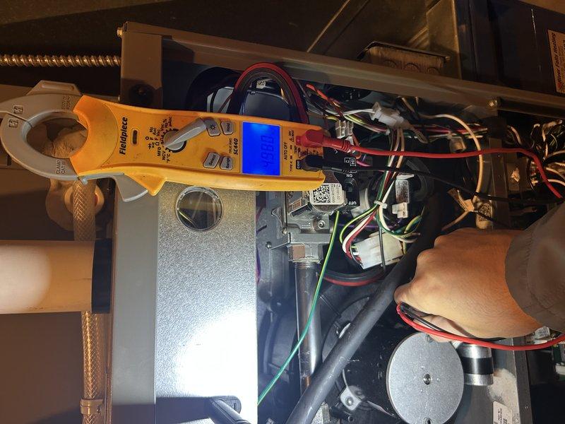 Performed comprehensive furnace tune-up on 2-year-old system, including operational testing with satisfactory temperature rise verification. Cleaned and inspected heat exchanger, electrical components, and controls with multimeter testing confirming proper voltage/amperage readings. Air filter was clean and air exchanger in good condition; all systems operating within specifications.