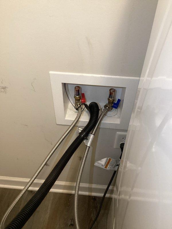 Responded to low water pressure issue affecting utility room, washer supply, and water softener. Diagnosed blockage in cold water supply lines embedded in slab. Used air compressor to clear debris by pushing back through angle stop with line cut off in mechanical room. Advised customer that complete resolution may require additional service with two technicians and specialized equipment to thoroughly blow out and trace all affected lines.