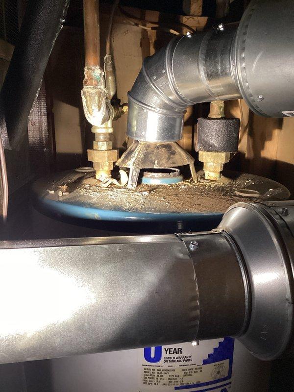 Completed plumbing inspection as part of real estate contingency, documenting conditions of kitchen plumbing fixtures and mechanical room components. Observed functional double-basin stainless steel kitchen sink with gooseneck faucet in good condition, and noted aging brass valve assembly in utility area showing signs of corrosion and mineral buildup that may require future maintenance.