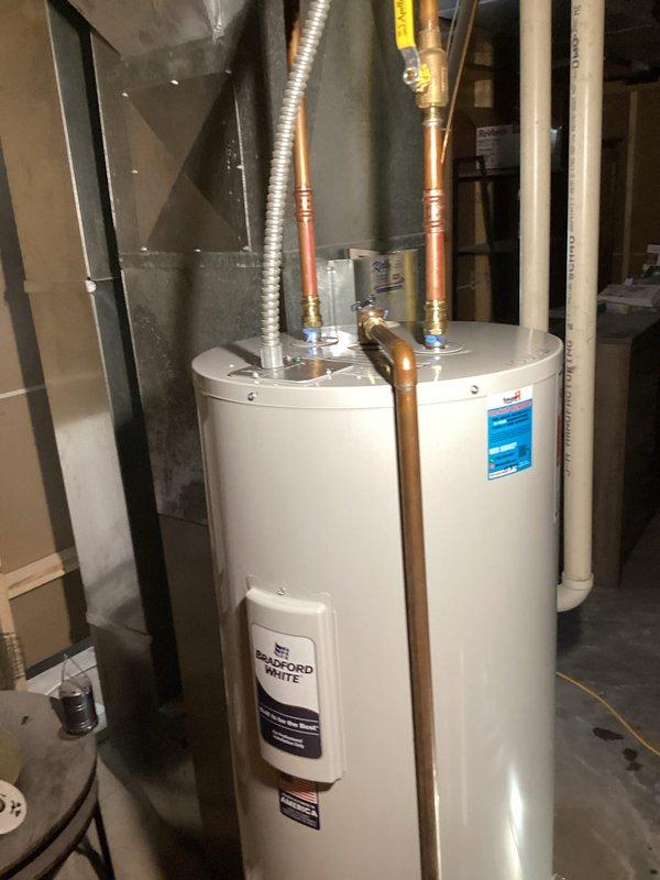 Responded to no hot water complaint in electric water heater system. Diagnosed unit failure following customer's breaker reset. Installed new Bradford White water heater with proper copper piping connections, including all necessary fittings and exhaust ventilation. System now functioning correctly with restored hot water service. Responded to no hot water complaint in electric water heater system. Diagnosed unit failure following customer's breaker reset. Installed new Bradford White water heater with proper copper piping connections, including all necessary fittings and exhaust ventilation. System now functioning correctly with restored hot water service.