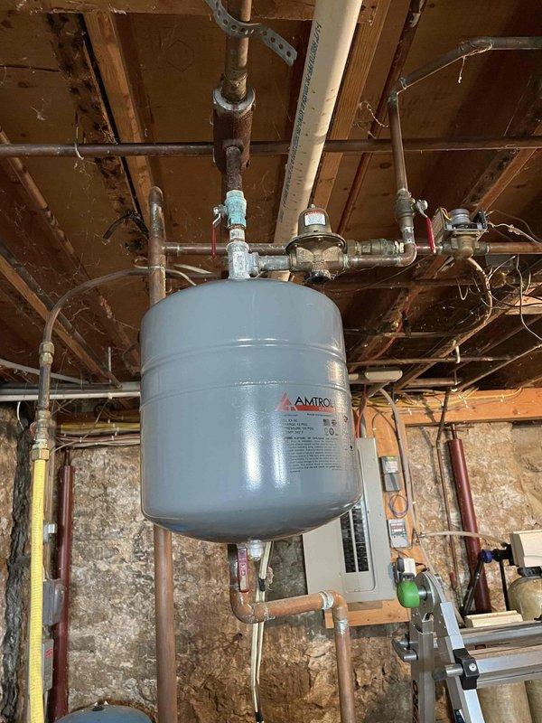 Completed a 2-hour repair service involving the replacement of an AMTROL expansion tank and rebuild of a zone valve in customer's basement heating system. After installation, system was properly bled of air and tested for proper circulation. Both zones now functioning correctly with heat distribution verified throughout.
