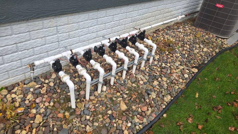 Responded to service call for irrigation system repair where a PVC union had broken due to pipe shifting over time. Upon inspection, located the damaged section of the irrigation line against the building's exterior wall. Repaired the broken connection by replacing the damaged union and realigning the PVC pipes to ensure proper alignment and prevent future stress on the joints. Tested the system after repair to confirm water flow was restored and no leaks were present.