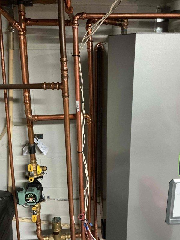 Completed boiler repair on 4-year-old NTI system by replacing internal pump, DHW relief valve, and auto vent air separator. After installation, refilled system, verified proper operation, and re-enabled domestic hot water function. System now functioning correctly.
