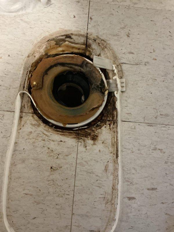 Completed replacement of deteriorated 15-year-old toilet in main floor bathroom following customer's repiping project. Removed damaged toilet and installed new Gerber Viper ADA-compliant elongated toilet with new wax ring and bolts. New fixture provides improved functionality with water-efficient operation, chemical resistance, and sanitary design features to prevent liquid intrusion under the tank.