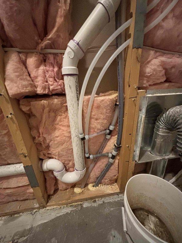 Successfully relocated laundry box without demolition work. Repositioned washer box with dual water valves and reconnected associated drain line, ensuring proper alignment and secure connections to existing plumbing system. All connections tested for leaks and proper function before completion.