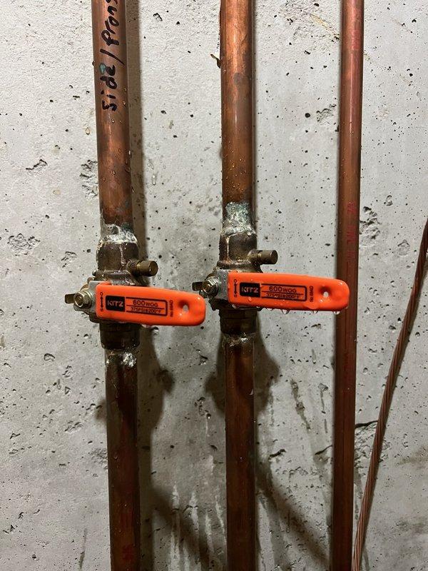 Inspected outdoor spigot shut-off valve system in basement and determined the existing valve does not fully close, allowing water to continue flowing even when in "off" position. Identified significant corrosion and mineral deposits at copper pipe joints and connection points. Customer advised of options for replacing the aging KITZ 600-150S valves, but elected to consider replacement at a later date and will temporarily manage by shutting off the exterior spigot at the house.