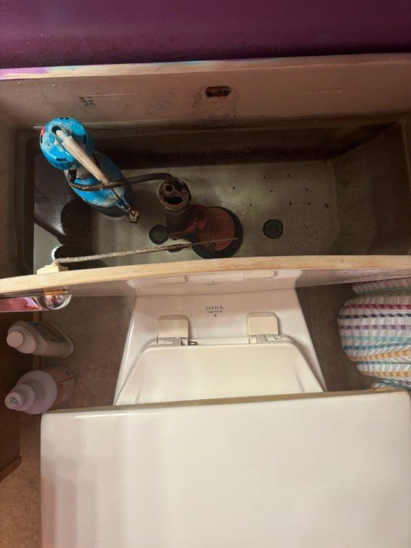 Responded to service call for non-flushing toilet. Upon inspection, discovered corroded internal components including a damaged flush valve assembly. Replaced faulty fill valve and flapper to restore proper toilet function.