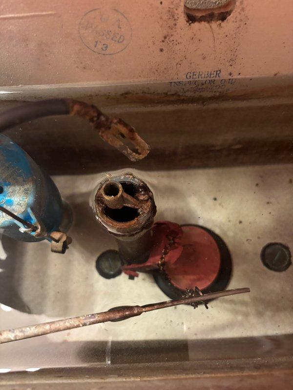 Responded to service call for non-flushing toilet. Upon inspection, discovered corroded internal components including a damaged flush valve assembly. Replaced faulty fill valve and flapper to restore proper toilet function.