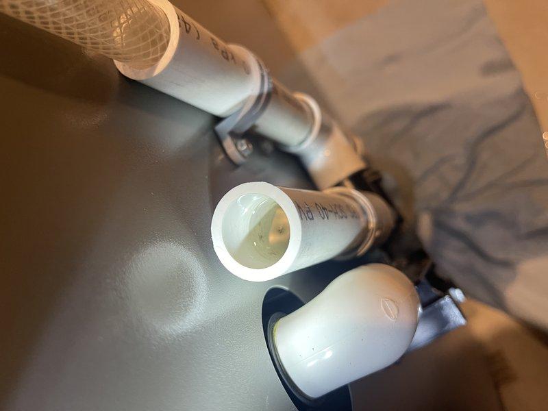 Responded to service call for newly installed furnace (8 days old) that ceased providing heat. Discovered condensate drain blockage caused by a wire nut lodged in the drain fitting, preventing proper drainage. Removed obstruction and verified proper condensate flow, restoring normal furnace operation.