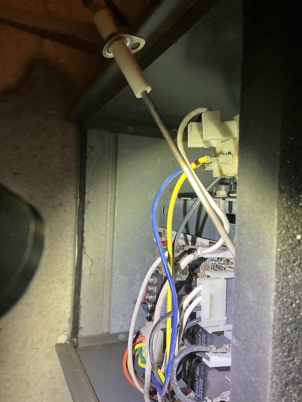 Conducted annual furnace tune-up on a 17-year-old system in 3-sided condo. Inspected electrical connections and control system components. System is functioning properly but at end of useful life; replacement recommended due to age.