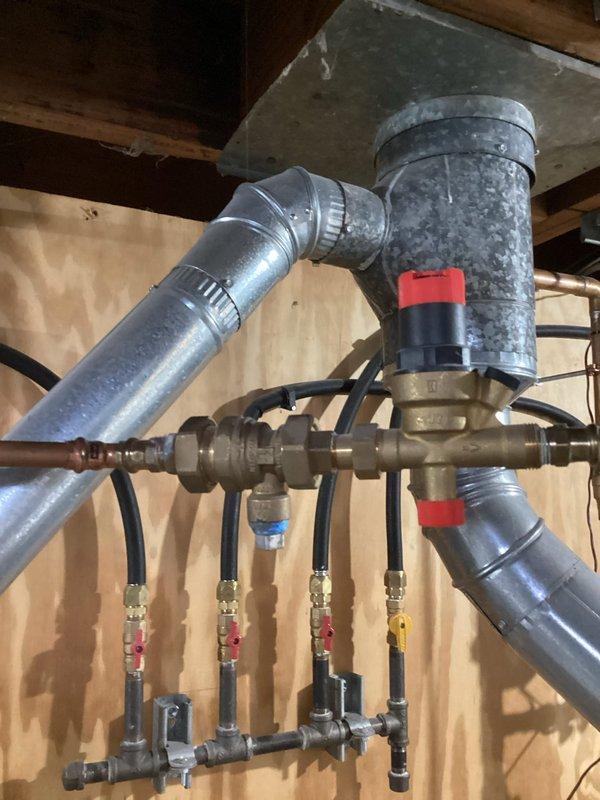 Replaced leaking backflow preventer on domestic water fill of boiler. Filled system and set pressure to 20psi, confirming absence of leaks. Observed discolored water with sediment; recommended system flush and Fernox treatment.