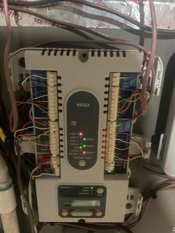 Responded to emergency no-heat call for a unit less than one year old under warranty. Diagnosed faulty zone board causing emergency heat failure. Replaced defective HZ322 Honeywell zone control board, restoring proper system function and heating capabilities.