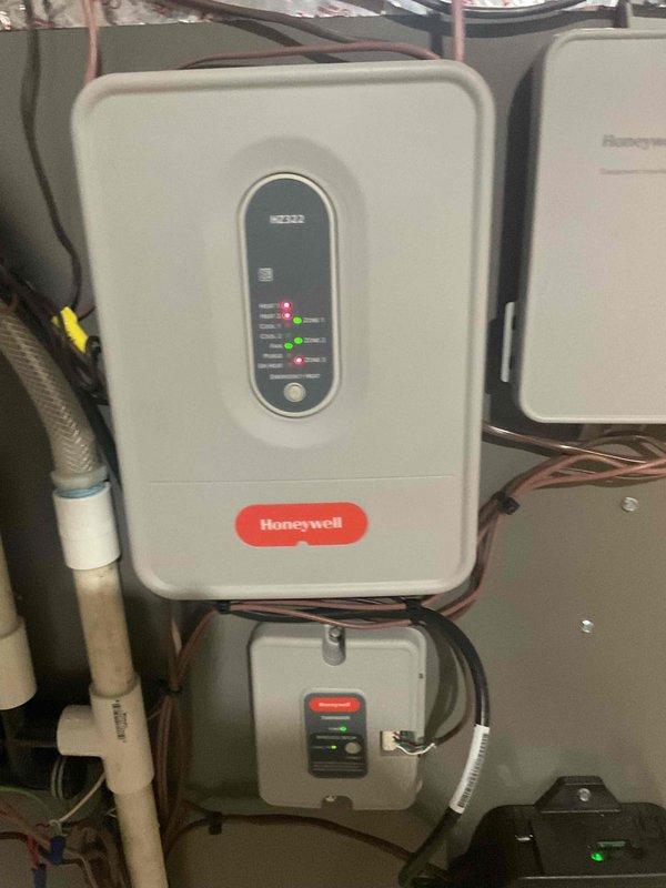 Responded to emergency no-heat call for a unit less than one year old under warranty. Diagnosed faulty zone board causing emergency heat failure. Replaced defective HZ322 Honeywell zone control board, restoring proper system function and heating capabilities.