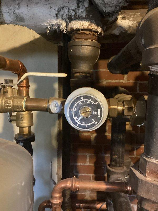 Completed annual 10-2 boiler tune-up per maintenance agreement. Performed flame retention pattern adjustment, cleaned routine components, bled radiators to improve system efficiency, and repaired minor gas leak on pilot assembly. Visual inspection of pressure gauge and piping system conducted. Vacuum-cleaned burner chamber to ensure proper combustion.