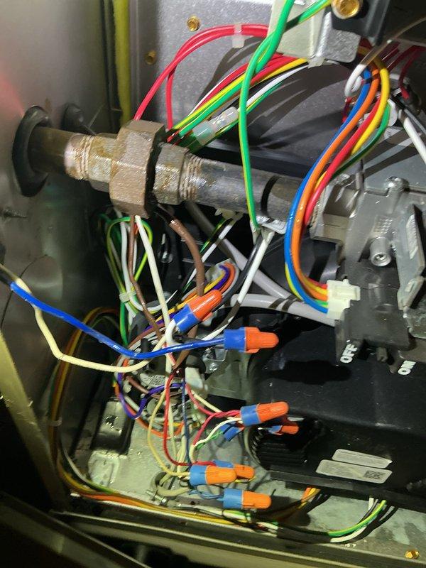 Responded to a recurring gas leak complaint at a 3-year-old furnace installation. Upon investigation, detected faint gas odor emanating from the burner compartment despite previous drip leg replacement. Leak testing with soap solution revealed no bubbles at fittings, suggesting gas valve as the probable source. Recommended gas valve replacement under potential warranty coverage; submitted request to parts department for necessary components and pricing.