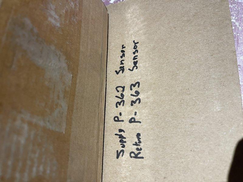 Responded to no-heat service call for boiler system displaying error code SLT-11603. Diagnosed inadequate airflow issue and identified faulty combustion blower and temperature sensors. Replaced combustion blower and determined both supply and return temperature sensors require replacement due to temperature differential readings (return 81°F reading higher than supply 75°F). Parts ordered for completion of repair.