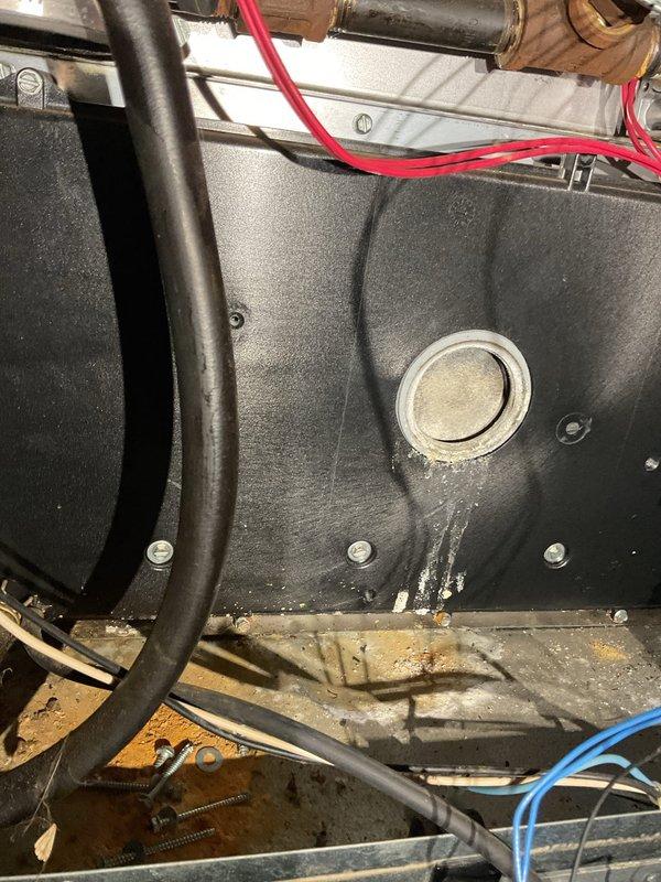 Responded to no-heat call for a furnace with pilot light ignition but non-functioning main burners. Diagnosed low continuity in flame sensor and performed cleaning with Scotch-Brite. While cleaning provided temporary improvement, advised customer about age and condition of furnace, noting this was a temporary solution. System uses Honeywell ProSeries thermostat and Smart Valve 6-1 control.