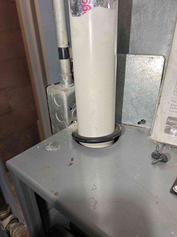 Performed comprehensive furnace tune-up safety inspection for daycare conversion. Discovered detached exhaust PVC connection that was improperly sealed; repaired with proper priming and gluing. Service included carbon monoxide testing, heat exchanger inspection, gas pressure adjustment, flame sensor cleaning, deep vacuum with removal of spider/debris buildup, condensation trap cleaning, and verification of condensation pump functionality. Noted incorrect filter installation and advised homeowner.