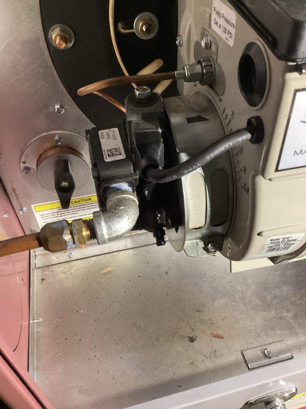 Performed comprehensive oil furnace tune-up service including replacement of oil filter, gaskets, nozzle (.65 80°B), and air filter. Inspected all critical components including transformer, ignition, control box, furnace board, wiring, blower, Beckett motor, sensors, combustion air, and venting. System purged of air from fuel line and successfully cycled, now operating normally.