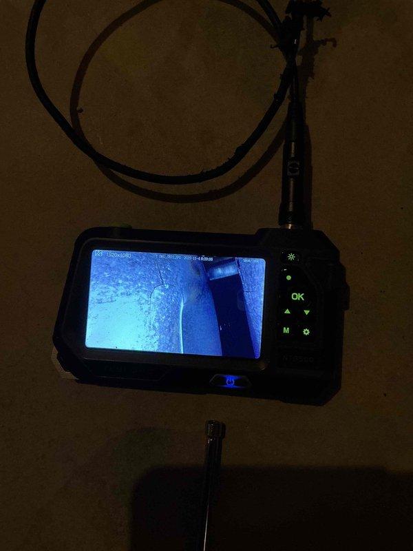 Performed no-heat service call on a 12-year-old Carrier furnace. Diagnosed failed draft inducer motor with seized bearings. Further inspection with borescope revealed significant heat exchanger cracks approximately 4 inches in length on both visible cells. Due to safety concerns, performed mandatory shutdown of the system and recommended complete unit replacement. Full system inspection could not be completed due to inoperable condition.