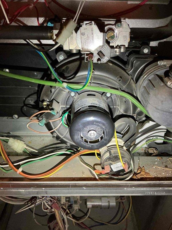 Performed no-heat service call on a 12-year-old Carrier furnace. Diagnosed failed draft inducer motor with seized bearings. Further inspection with borescope revealed significant heat exchanger cracks approximately 4 inches in length on both visible cells. Due to safety concerns, performed mandatory shutdown of the system and recommended complete unit replacement. Full system inspection could not be completed due to inoperable condition.