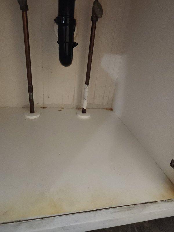 Diagnosed and repaired a pinhole leak in the master bathroom cold water supply line to the lavatory. Identified failure of customer's previous DIY repair attempt using JB Weld epoxy. Successfully repaired the compromised copper pipe section, restoring proper function and eliminating the leak.