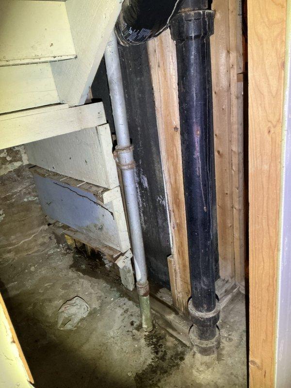 Diagnosed and replaced rusted kitchen drain pipe at concrete floor in basement where severe deterioration was causing drainage issues. Installed proper venting for kitchen sink to ensure proper drainage function and prevent future backups.