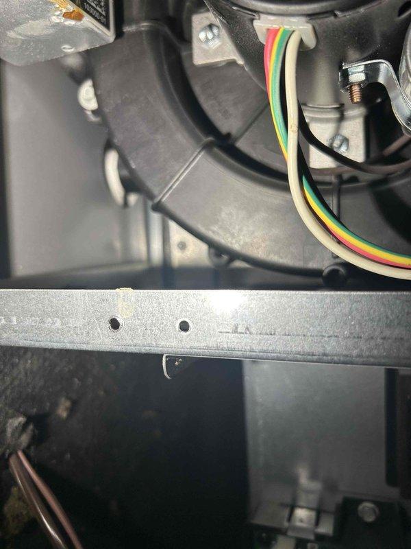 Responded to service call for water leakage under furnace. Upon inspection, found exhaust PVC tube disconnected causing condensate drainage and water pooling beneath electrical components and front panel. Reconnected exhaust tube to proper position, verified all electrical components were undamaged and functioning correctly. Thoroughly cleaned water from furnace panel, surrounding area, and floor to prevent potential damage.